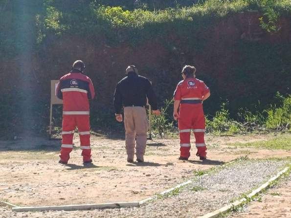 DJE instructor running a live-fire training session with two students